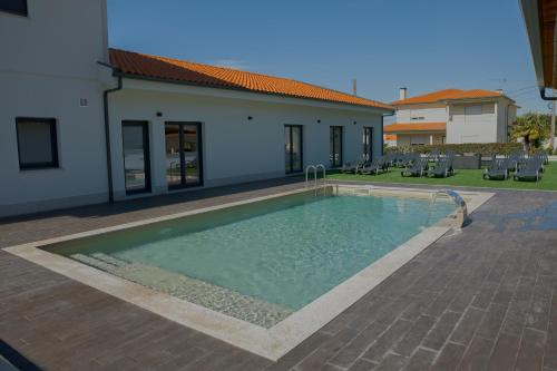 Πισίνα στο ή κοντά στο Moradia Sossegada Com Piscina
