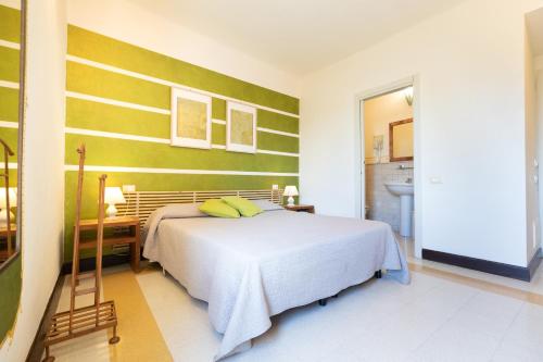 a bedroom with a bed and a desk in a room at Hotel Al Convento in Vezzano Ligure