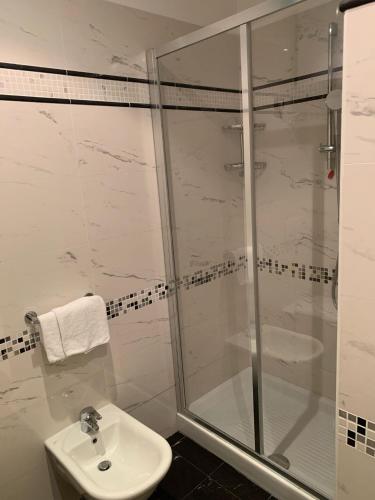 a bathroom with a shower and a sink at Residence Atlantic in Alassio
