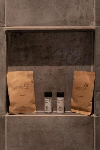 a shelf with two coffee cups and a bag at Anemos Suites Mani 