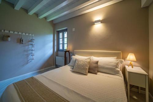 Katil atau katil-katil dalam bilik di Agriturismo Cascina Carai