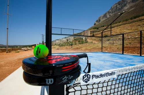 a tennis ball sitting on top of a tennis court at Anemos Suites Mani 