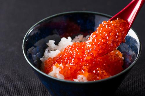a blue bowl filled with rice and red sauce at La'gent Stay Sapporo Odori Hokkaido in Sapporo