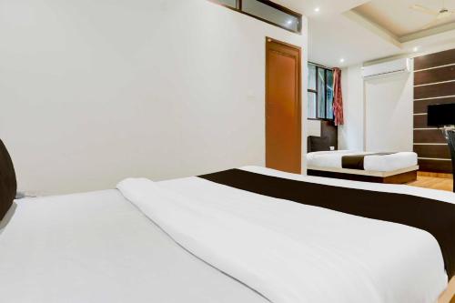 Postel nebo postele na pokoji v ubytování Hotel O Jaigaon Near Bhutan Gate