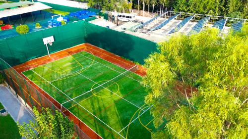 an overhead view of a tennis court with a court at Senza Sunset Beach Hotel in Alanya