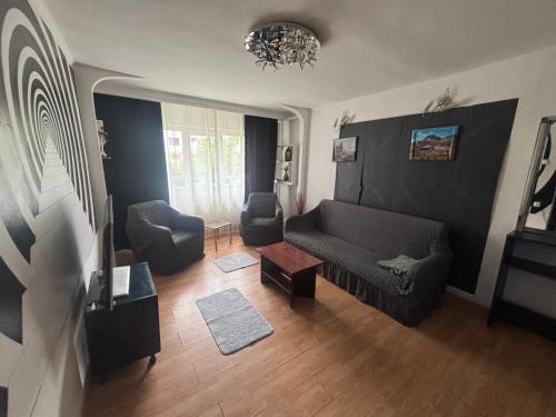 Posezení v ubytování Hypnotic Suite Pitesti 1