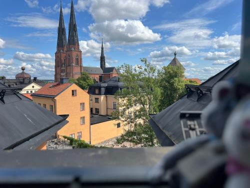 a view of a city skyline with a church at Akademihotellet in Uppsala