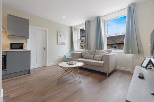 a living room with a couch and a table at Flat1 1BR in Horsemarket in Barnard Castle