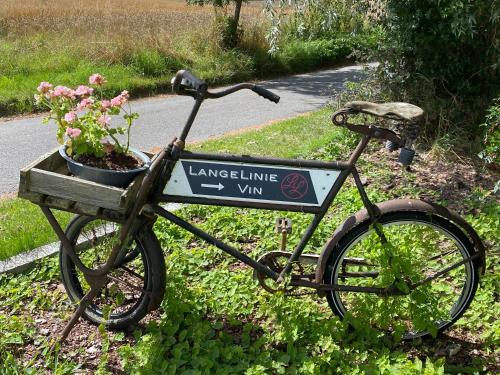 a bike with a sign on the side of a road at Langelinie Vin - Countryside in Frederikssund