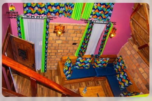 a view of a room with a staircase and a living room at Masaka Cultural Resort in Masaka