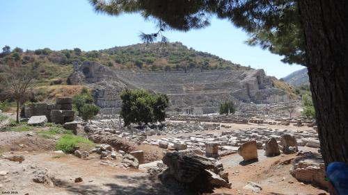 an ancient amphitheater with a hill in the background at Emel Pension in Guzelcamlı