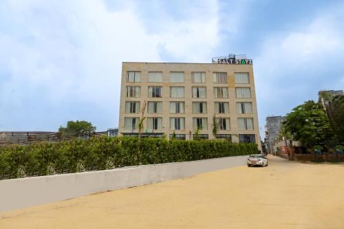 a car is parked in front of a building at Saltstayz Premier - Manesar & Sector 86 in Gurgaon