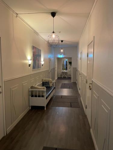 a hallway with a living room with a couch at Högsnäsgården in Överhörnäs