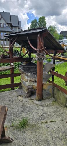 a picnic table with a basketball hoop in a park at Pokoje gościnne u Krupy in Murzasichle