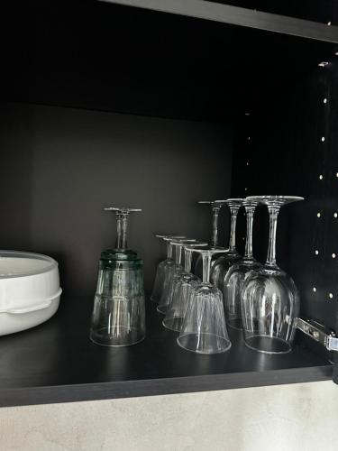a row of glass vases sitting on a shelf at La Suite élégante in Saint Lo