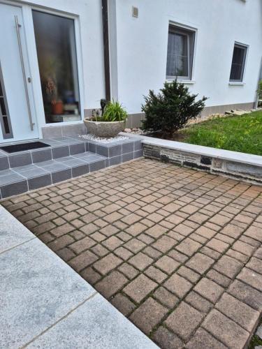 a brick walkway in front of a house at Ferienwohnung Selb in Selb