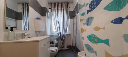 a bathroom with a toilet and a sink at Casa Margherita in Pairola