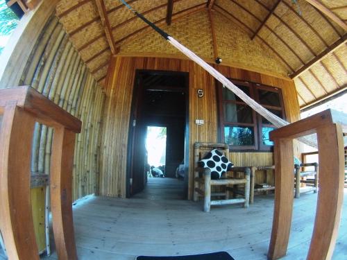 an inside view of a room in a house at Abdi Fantastik in Gili Air