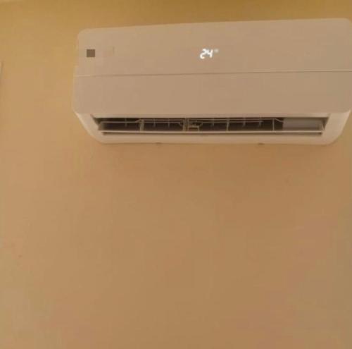 a air conditioner on the ceiling of a room at Hoceima in Al Hoceïma