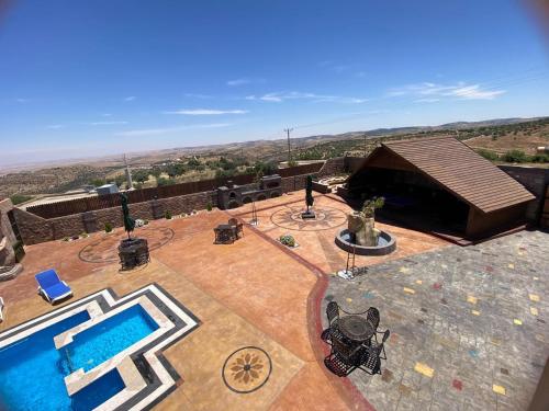 Bazén v ubytování منتجع كفريا السياحي-عجلون Kufraya Resort-Ajloun nebo v jeho okolí