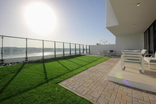 a balcony of a building with a view of the ocean at Silk Valley - 4B near Al Hamriyah | private beach access in Sharjah