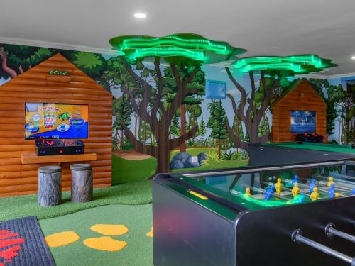 a childrens play room with a video game system at Cayley Mountain Resort in Champagne Valley