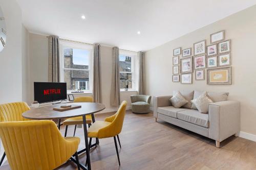 a living room with a couch and a table at Flat2 2BR in Horsemarket in Barnard Castle