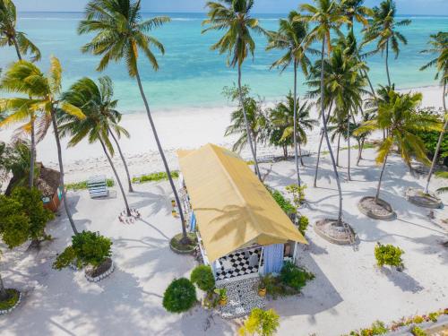 an aerial view of a resort on the beach at ZAN Orient Beach Hotel in Bwejuu
