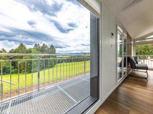 a room with a balcony with a large glass window at Holiday Home Karoline by Interhome in Aschach an der Steyr