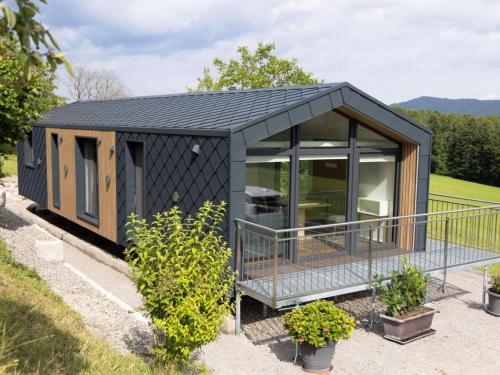 a black shipping container house with a roof at Holiday Home Karoline by Interhome in Aschach an der Steyr