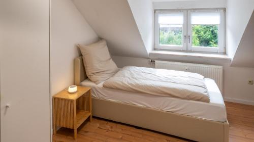 Katil atau katil-katil dalam bilik di Stilvolle Dachgeschosswohnung