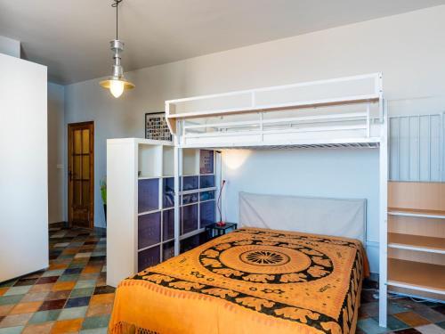 a bedroom with a bunk bed in a room at Apartment La Terrazza by Interhome in Cipressa