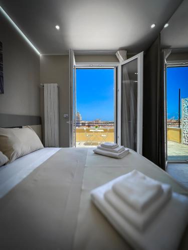 Postel nebo postele na pokoji v ubytování Settimo Cielo al Massimo Guest House