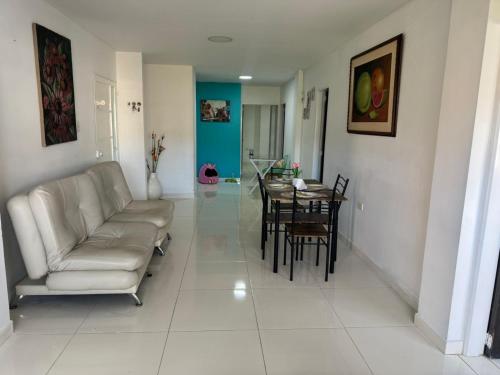 a living room with a couch and a table at Apartamento Pitalito in Pitalito