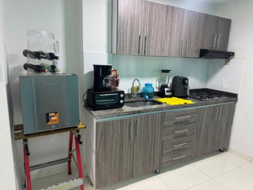 a kitchen with a sink and a counter top at Apartamento Pitalito in Pitalito