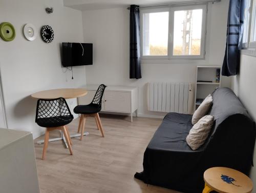 TV a/nebo společenská místnost v ubytování Appartement a la Campagne