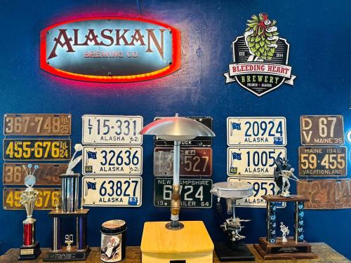 a bunch of signs on the wall of a garage at Alaska Getaway in Palmer
