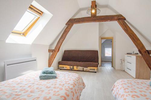 Ένα ή περισσότερα κρεβάτια σε δωμάτιο στο Chez mamie gigi