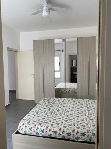 Ένα ή περισσότερα κρεβάτια σε δωμάτιο στο SGC Boa Vista Apartments