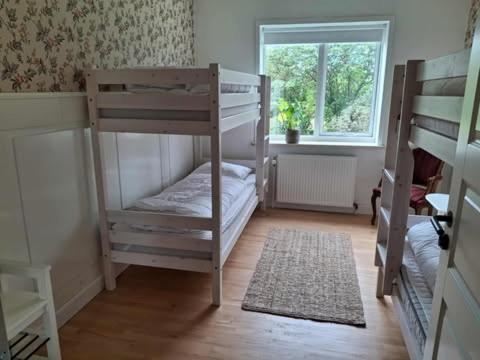 Una cama o camas en una habitación de Vrensted Hostel B&B