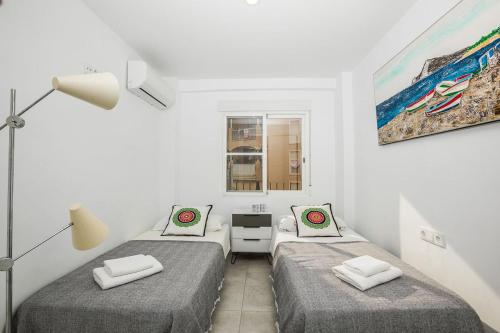 Postel nebo postele na pokoji v ubytování Mimosa Calpe Apartament