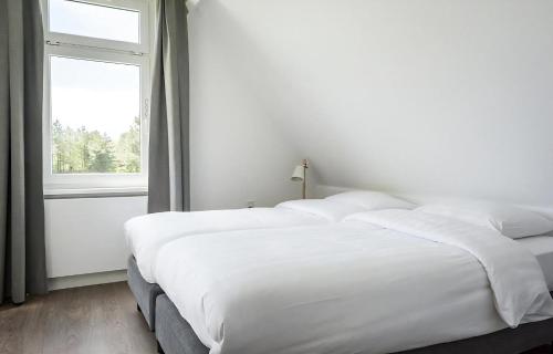 Postel nebo postele na pokoji v ubytování E-23 Bouwlust