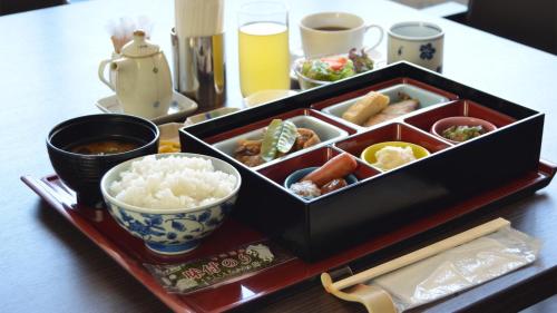 a tray of food on a table with rice at SAIDAIJI GRAND HOTEL - Vacation STAY 92822 in Okayama