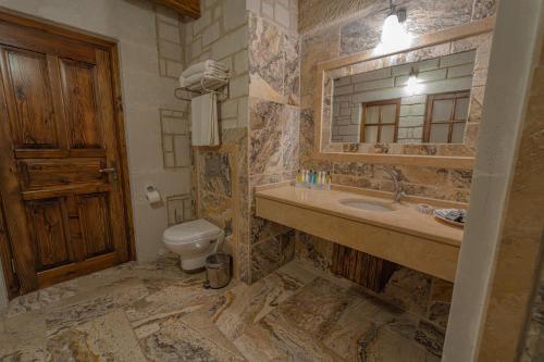 a bathroom with a sink and a toilet at Zara Cave Hotel in Goreme