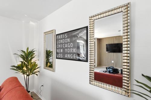a mirror on a wall in a living room at The Mulberry in Logan