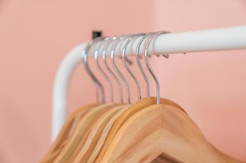 a wooden jacket hanging on a rack at Unique Victorian Home in Glasgow in Glasgow