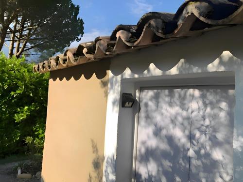 a white building with a tiled roof at Oasi Des Mirabelles - Gîte in Mirabel-aux-Baronnies