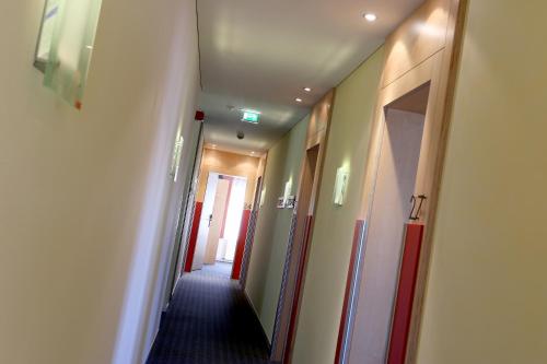 a corridor of a hotel room with a hallway at Schäfle Feldkirch-Altenstadt in Feldkirch