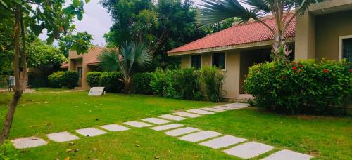 a garden in front of a house at melberry villa in Sānand