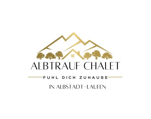a logo for an alpine chalet with mountains and trees at Albtrauf Chalet in Albstadt